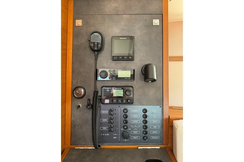  Yacht Photos Pics Control panel of a 2020 Jeanneau Sun Odyssey 349 sailboat with navigation equipment.