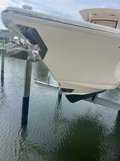 Outnumbered Yacht Photos Pics 2020 Scout 277LXF boat docked on water, showcasing sleek design and modern features.