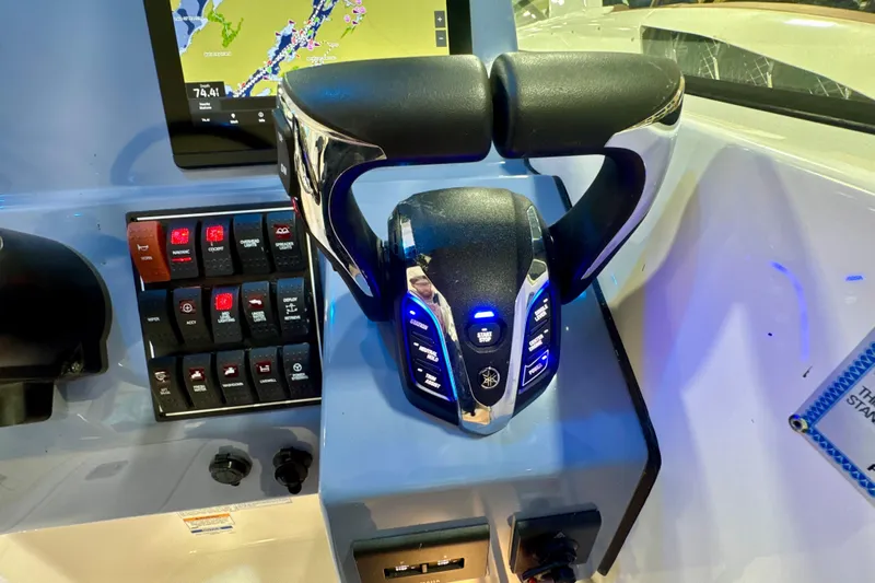  Yacht Photos Pics 2024 Pursuit DC 266 Dual Console boat dashboard with controls and navigation display.