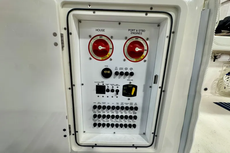  Yacht Photos Pics Electrical panel of 2024 Pursuit DC 266 Dual Console boat, featuring switches and controls.