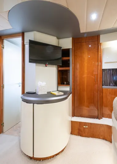  Yacht Photos Pics Interior of 1996 Mochi Craft 25 Mega yacht with modern furnishings and TV.