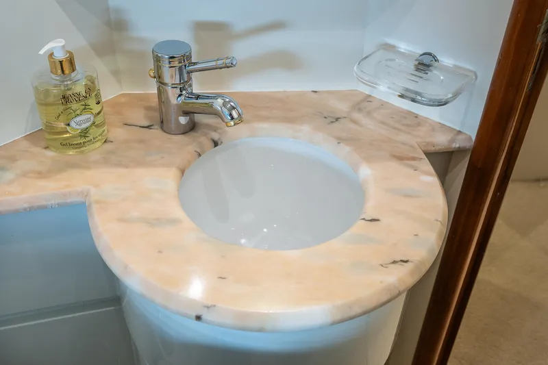  Yacht Photos Pics Marble sink with modern faucet on Mochi Craft 25 Mega yacht, 1996 model.