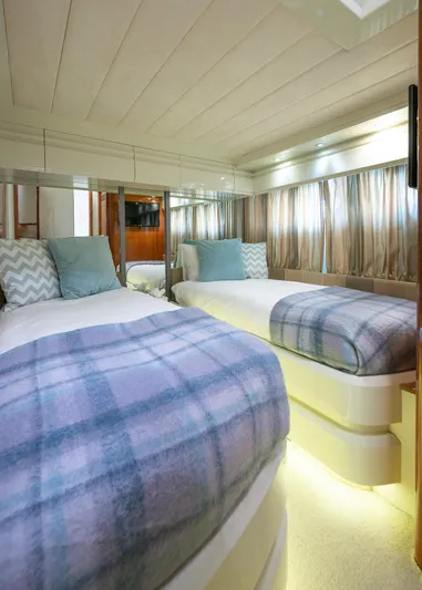  Yacht Photos Pics Luxurious twin bedroom in 1996 Mochi Craft 25 Mega yacht with elegant decor.
