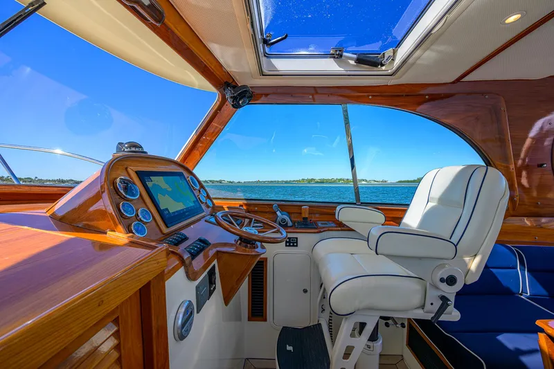 Cara Mia Yacht Photos Pics Helm of 2010 Hinckley Picnic Boat 37 MKIII with luxurious seating and navigation controls.