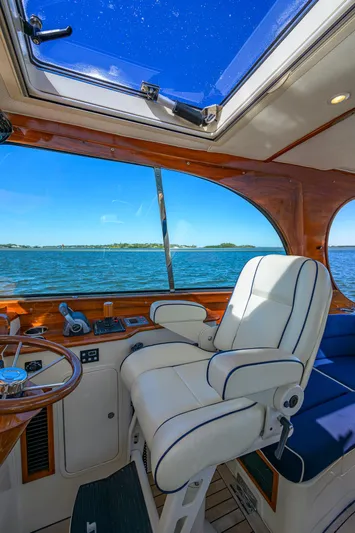 Cara Mia Yacht Photos Pics Interior of 2010 Hinckley Picnic Boat 37 MKIII with ocean view through large windows.