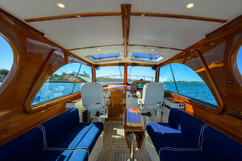 Cara Mia Yacht Photos Pics Interior of 2010 Hinckley Picnic Boat 37 MKIII with luxurious seating and wooden finishes.