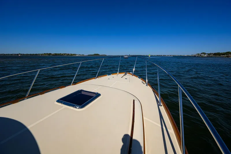 Cara Mia Yacht Photos Pics 2010 Hinckley Picnic Boat 37 MKIII cruising on open water under clear blue skies.