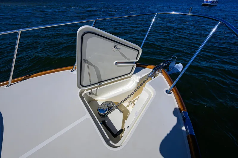 Cara Mia Yacht Photos Pics Hinckley Picnic Boat 37 MKIII 2010 anchor hatch open on deck, ocean background.