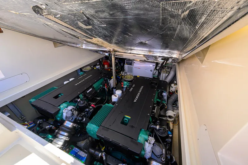 Cara Mia Yacht Photos Pics Engine compartment of 2010 Hinckley Picnic Boat 37 MKIII, featuring dual engines and mechanical components.