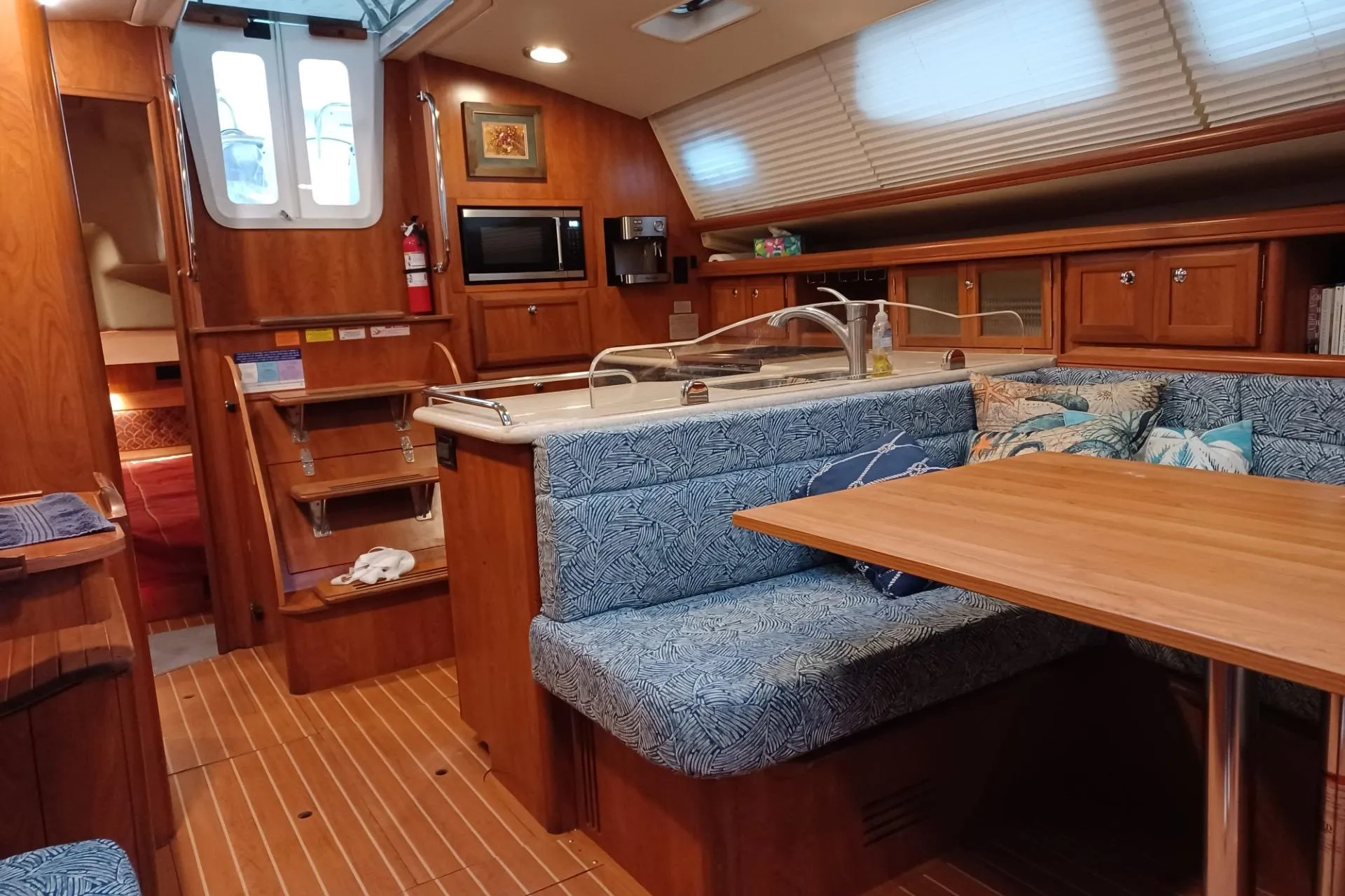 Luxurious 2011 Hunter 45 Deck Salon interior with cozy seating and modern kitchen amenities.