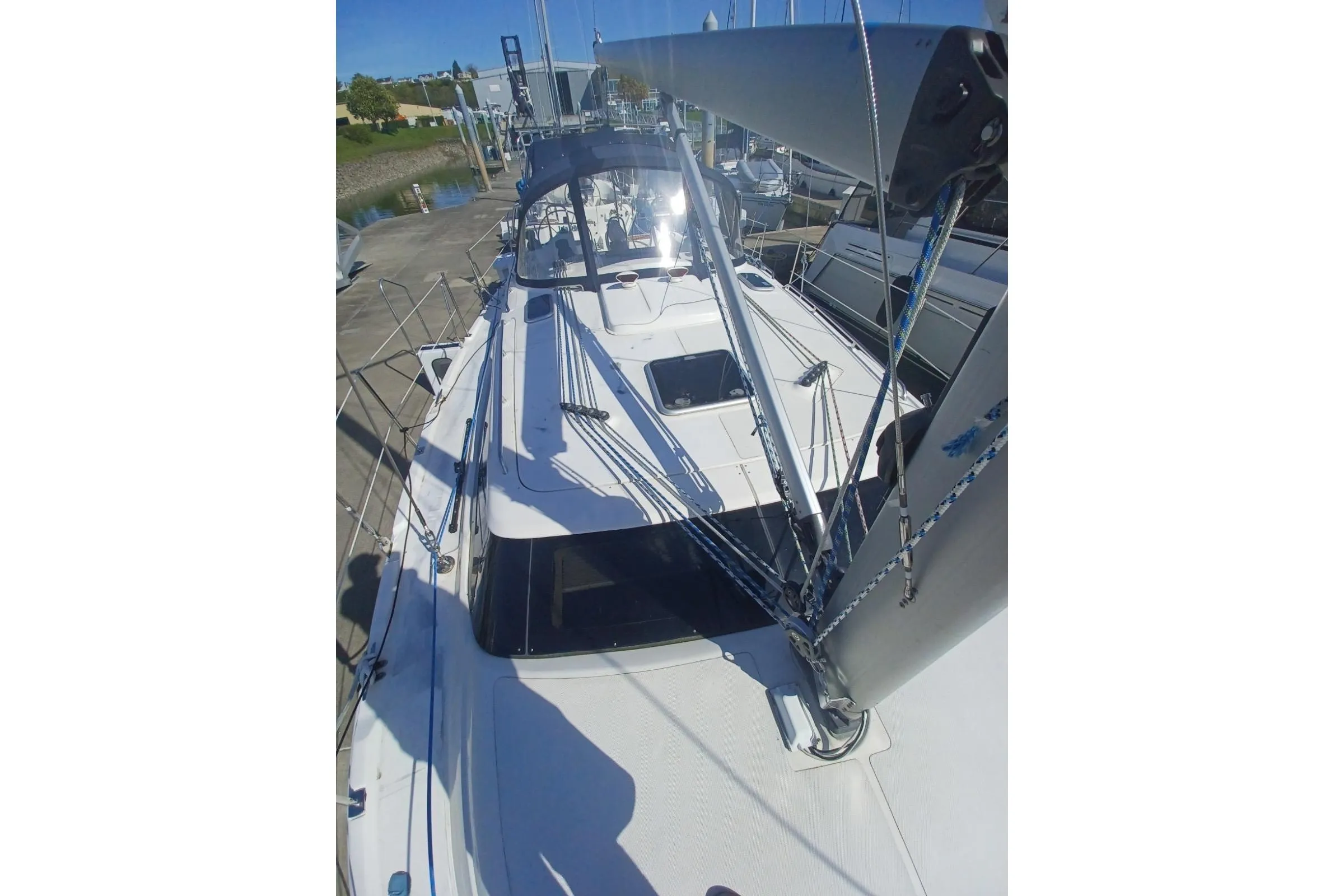 2011 Hunter 45 Deck Salon sailboat docked, showcasing deck and rigging.