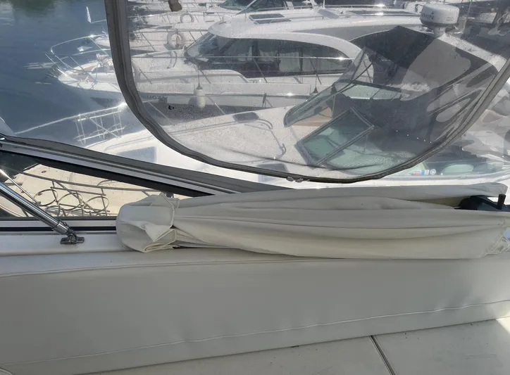  Yacht Photos Pics 2005 Meridian 490 Pilothouse interior with marina view through window.