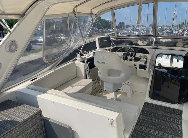  Yacht Photos Pics 2005 Meridian 490 Pilothouse yacht interior with helm, seating, and navigation equipment.