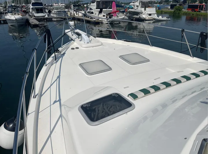  Yacht Photos Pics 2005 Meridian 490 Pilothouse yacht docked at marina, featuring spacious deck and mooring lines.