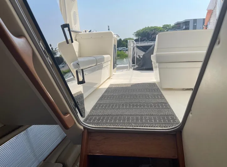  Yacht Photos Pics Interior view of 2005 Meridian 490 Pilothouse yacht, featuring seating and outdoor deck.