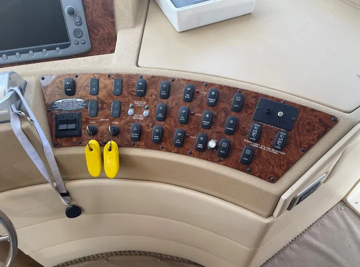  Yacht Photos Pics Control panel of a 2005 Meridian 490 Pilothouse boat with various switches and labels.