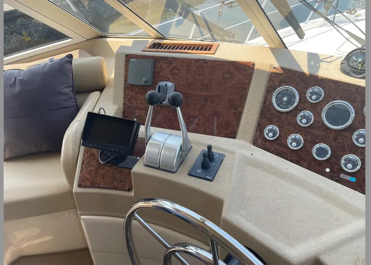  Yacht Photos Pics 2005 Meridian 490 Pilothouse helm with controls, gauges, and navigation equipment.