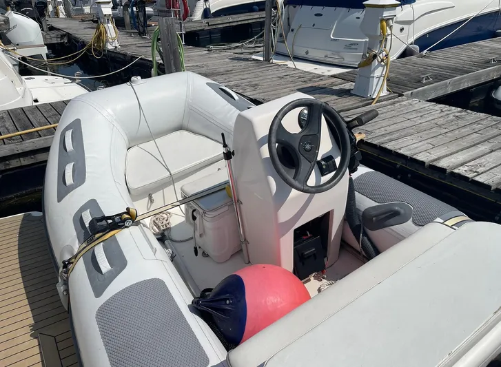  Yacht Photos Pics Inflatable boat docked near a 2005 Meridian 490 Pilothouse yacht.