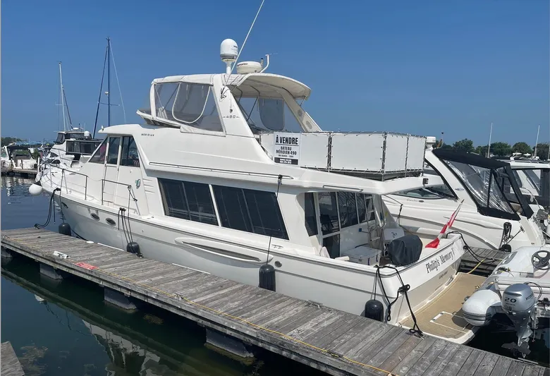  Yacht Photos Pics 2005 Meridian 490 Pilothouse yacht docked at marina under clear blue sky.