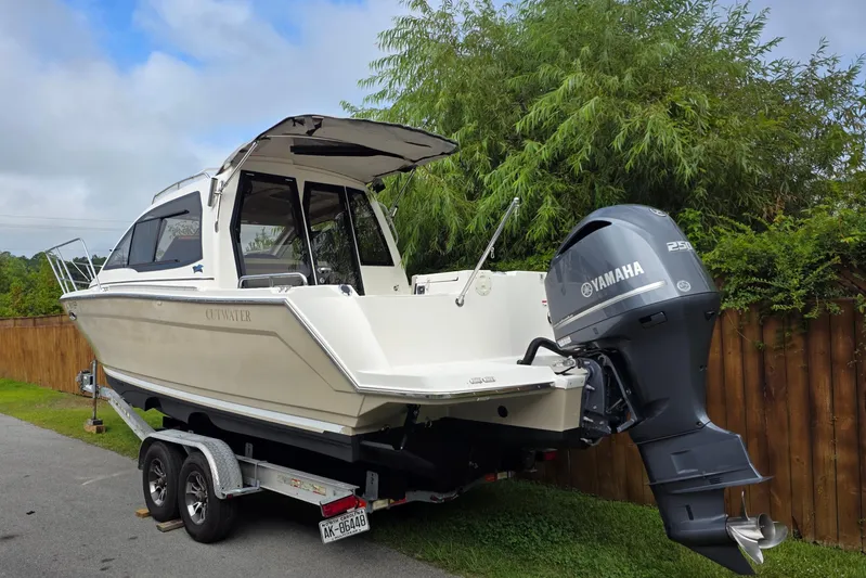  Yacht Photos Pics 2020 Cutwater C-24 boat with Yamaha engine on trailer, parked outdoors.