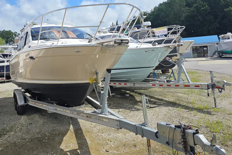  Yacht Photos Pics 2020 Cutwater C-24 boat on trailer, displayed outdoors at a dealership.
