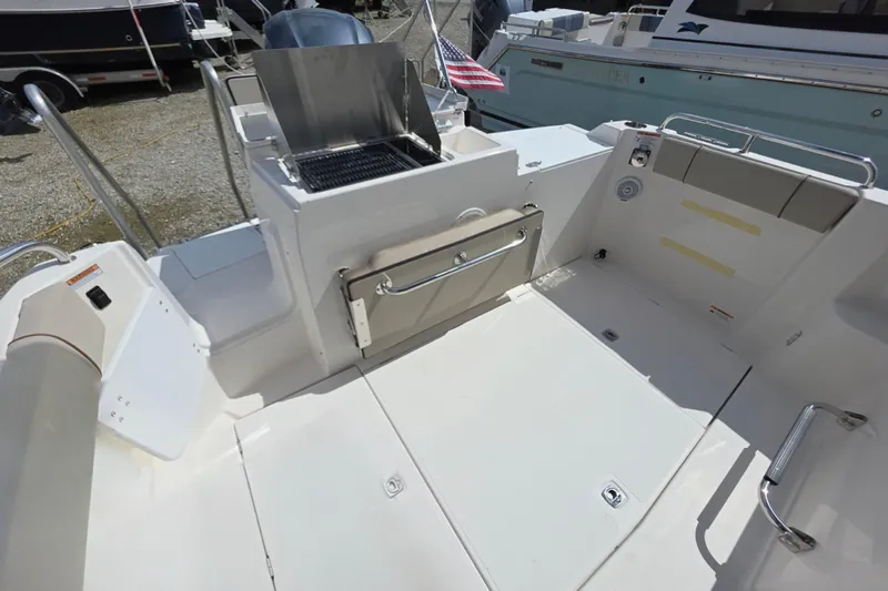  Yacht Photos Pics 2020 Cutwater C-24 boat deck with grill and seating area.