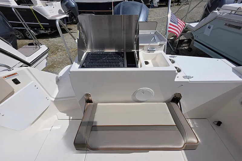  Yacht Photos Pics 2020 Cutwater C-24 boat with outdoor grill and seating area.