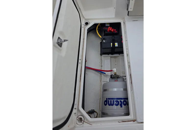  Yacht Photos Pics 2020 Cutwater C-24 boat compartment with battery and water heater.