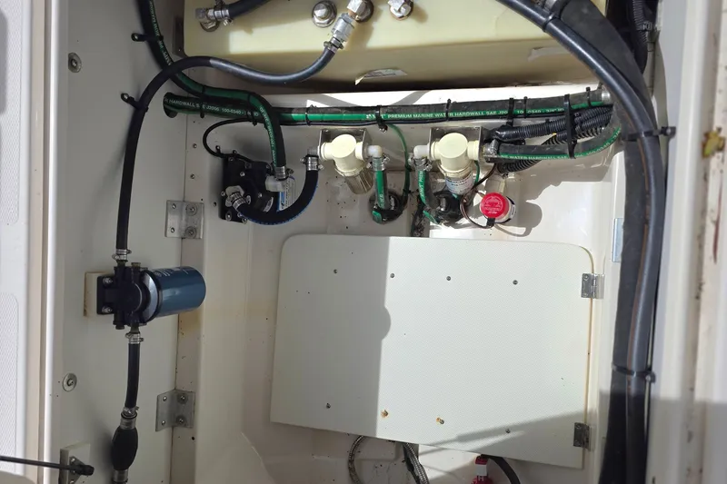  Yacht Photos Pics 2020 Cutwater C-24 engine compartment with hoses, filters, and wiring.