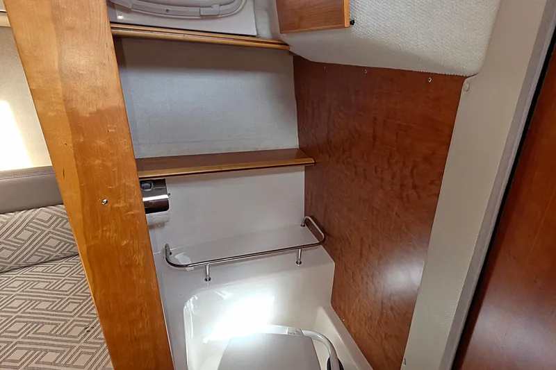  Yacht Photos Pics 2020 Cutwater C-24 interior cabin with wooden accents and compact design.