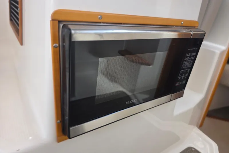  Yacht Photos Pics Built-in microwave in 2020 Cutwater C-24 boat interior.