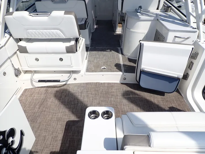 2022 World Cat 325 Dc Yacht Photos Pics 2022 World Cat 325 DC boat interior with seating and storage compartments.