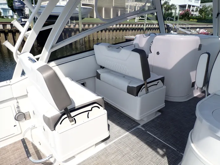 2022 World Cat 325 Dc Yacht Photos Pics 2022 World Cat 325 DC boat interior with seating and storage compartments.