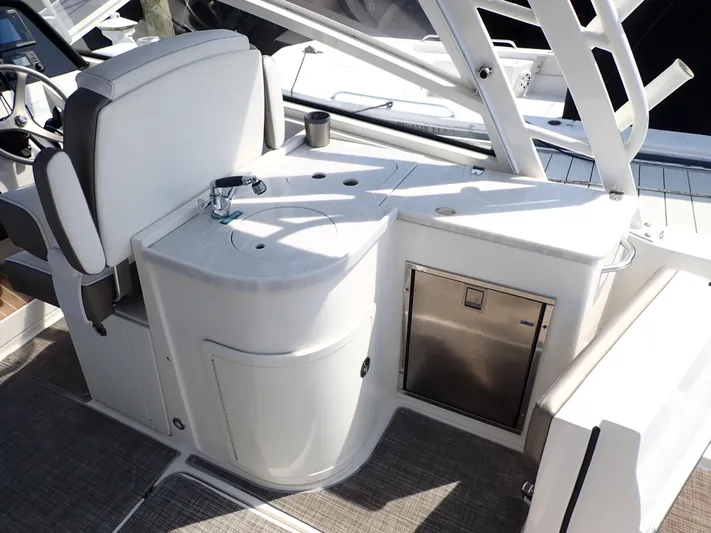 2022 World Cat 325 Dc Yacht Photos Pics 2022 World Cat 325 DC boat interior with sink and seating area.