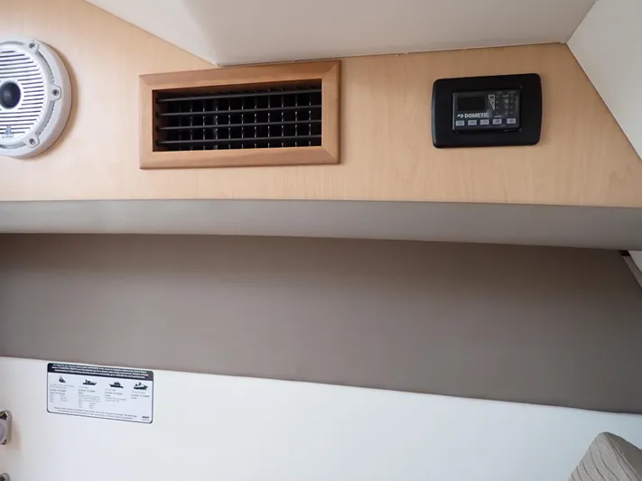 2022 World Cat 325 Dc Yacht Photos Pics Interior of 2022 World Cat 325 DC boat with speaker, vent, and control panel.