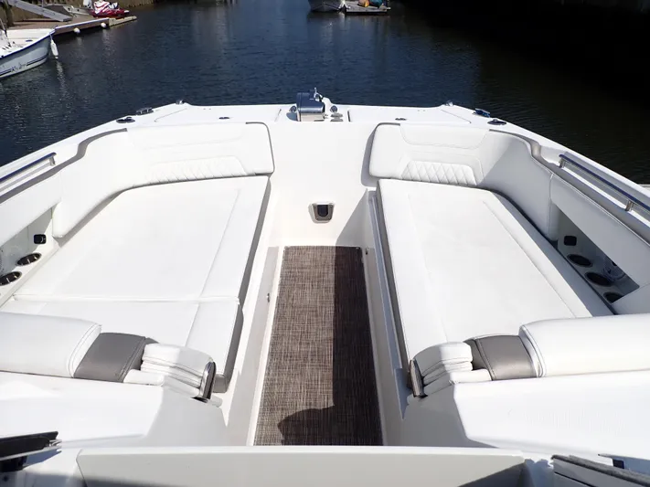 2022 World Cat 325 Dc Yacht Photos Pics 2022 World Cat 325 DC boat interior with white seating and water view.