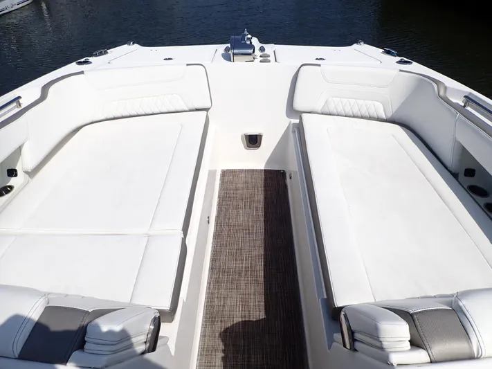 2022 World Cat 325 Dc Yacht Photos Pics 2022 World Cat 325 DC boat interior with white seating and water view.