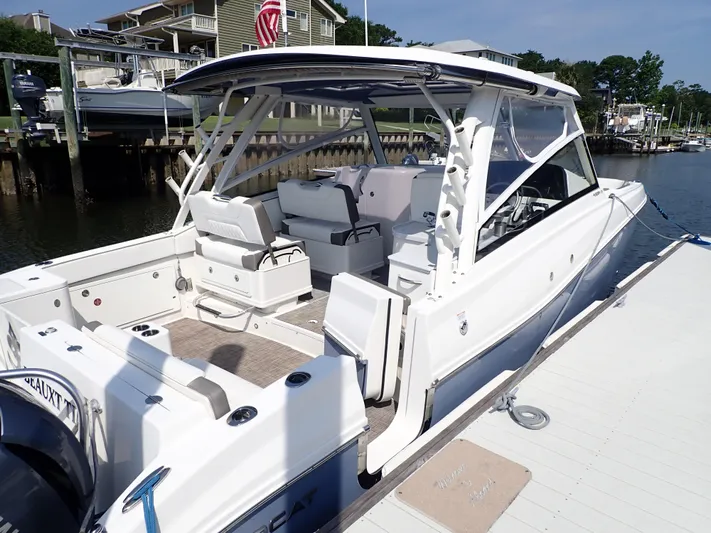 2022 World Cat 325 Dc Yacht Photos Pics 2022 World Cat 325 DC boat docked, showcasing spacious seating and sleek design.