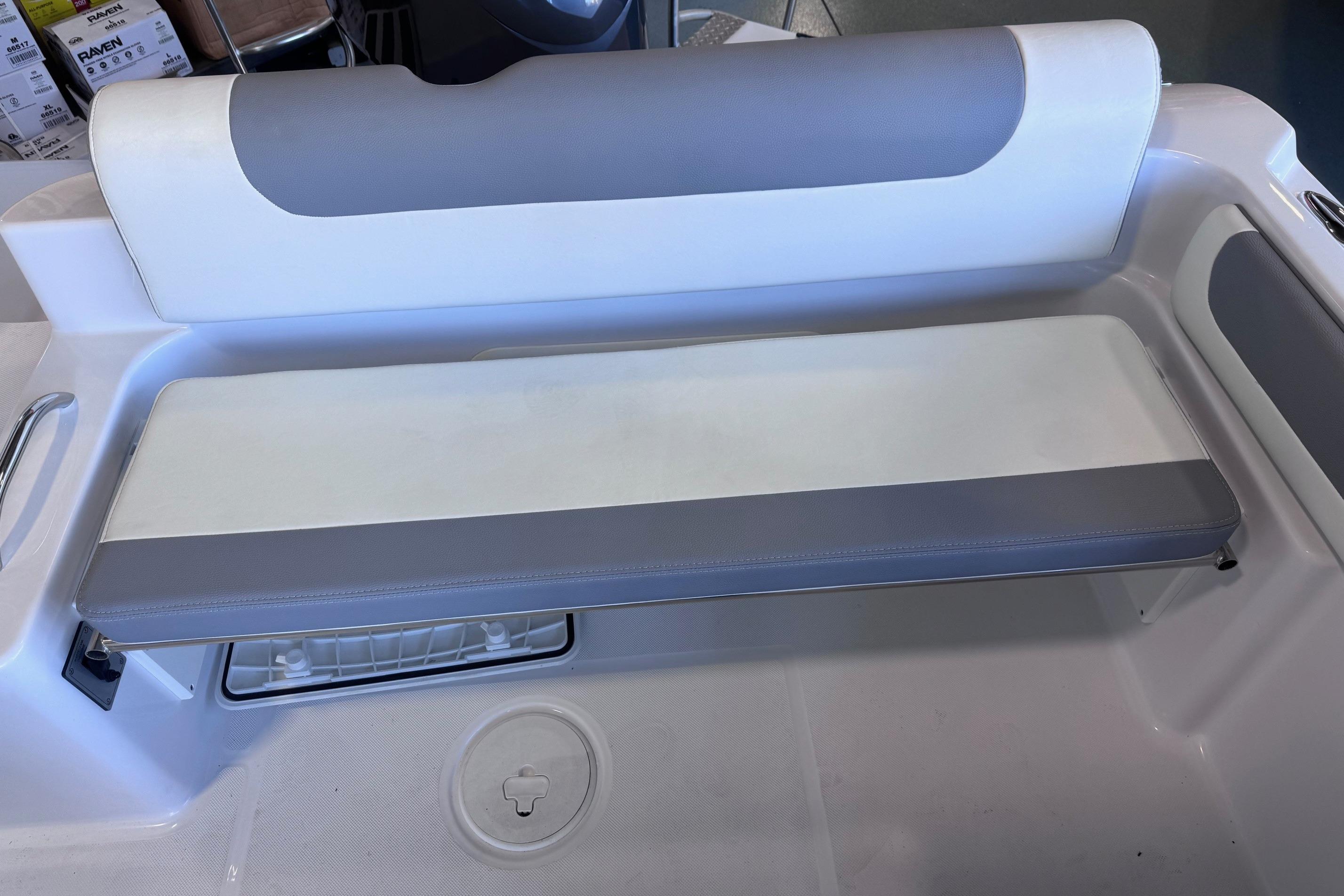 2023 Release 230 DC boat seat with gray and white cushioned design.
