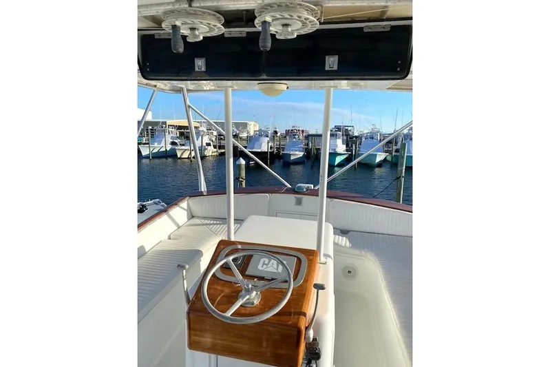 Rebel Child Yacht Photos Pics 1988 Buddy Davis 47 Custom Carolina boat helm with marina view.