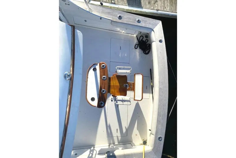 Rebel Child Yacht Photos Pics 1988 Buddy Davis 47 Custom Carolina boat deck with fishing chair and rod holders.