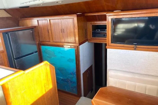 Rebel Child Yacht Photos Pics Interior of 1988 Buddy Davis 47 Custom Carolina yacht with wood cabinetry and modern amenities.