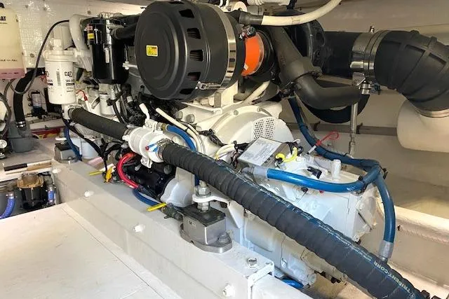 Rebel Child Yacht Photos Pics Engine room of 1988 Buddy Davis 47 Custom Carolina boat, showcasing detailed machinery.