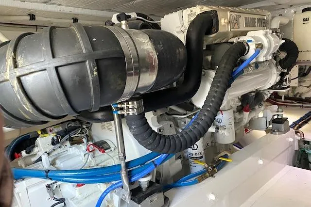 Rebel Child Yacht Photos Pics Engine room of 1988 Buddy Davis 47 Custom Carolina boat, showcasing mechanical components.