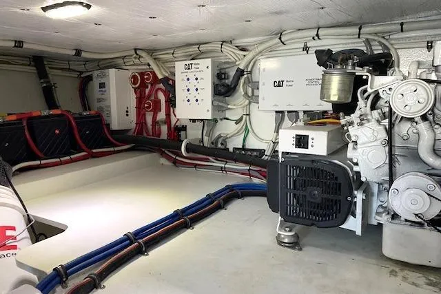 Rebel Child Yacht Photos Pics Engine room of 1988 Buddy Davis 47 Custom Carolina boat, featuring CAT machinery.