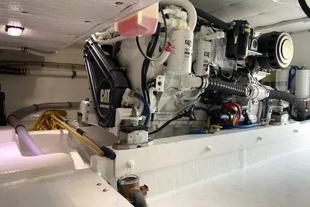 Rebel Child Yacht Photos Pics Engine room of 1988 Buddy Davis 47 Custom Carolina boat, featuring CAT machinery.