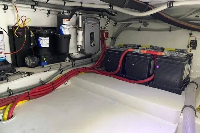 Rebel Child Yacht Photos Pics Engine room of 1988 Buddy Davis 47 Custom Carolina with batteries and wiring.