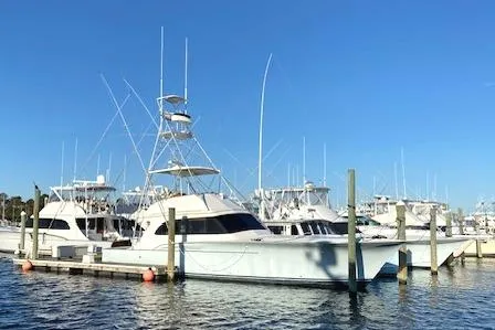 Rebel Child Yacht Photos Pics 1988 Buddy Davis 47 Custom Carolina yacht docked at marina under clear blue sky.