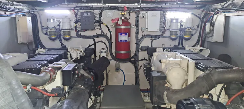 Zen Yacht Photos Pics Engine room of 2015 Sea Ray L650 Fly yacht, featuring dual engines and fire suppression system.
