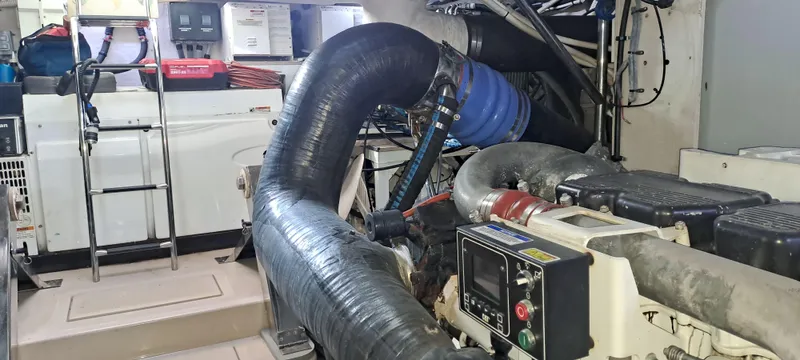 Zen Yacht Photos Pics Engine room of 2015 Sea Ray L650 Fly yacht, showcasing machinery and equipment.